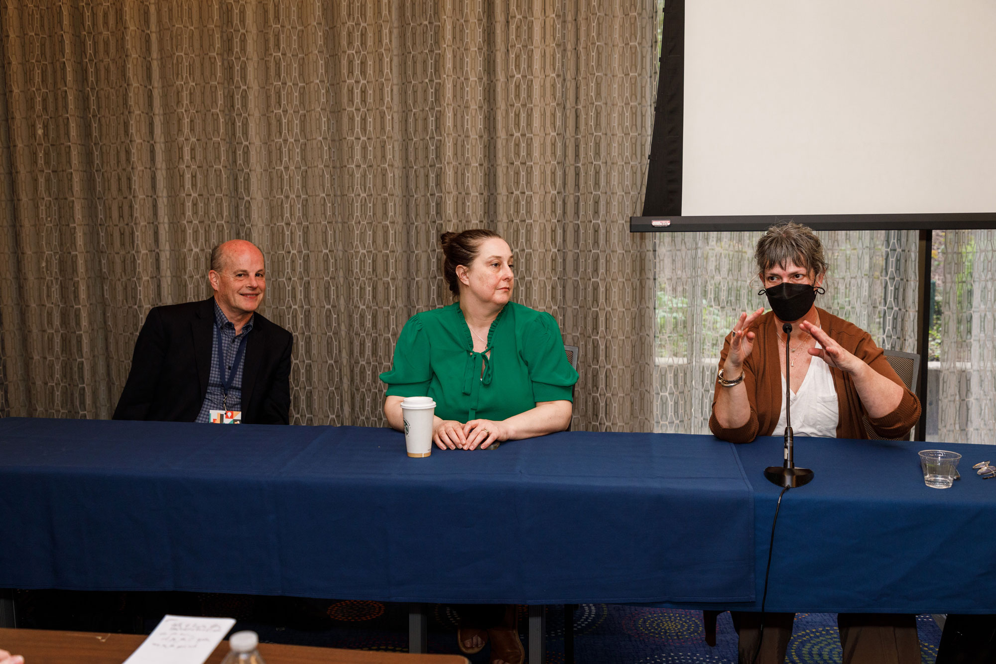 Three people seated at the National Association of Workforce Boards