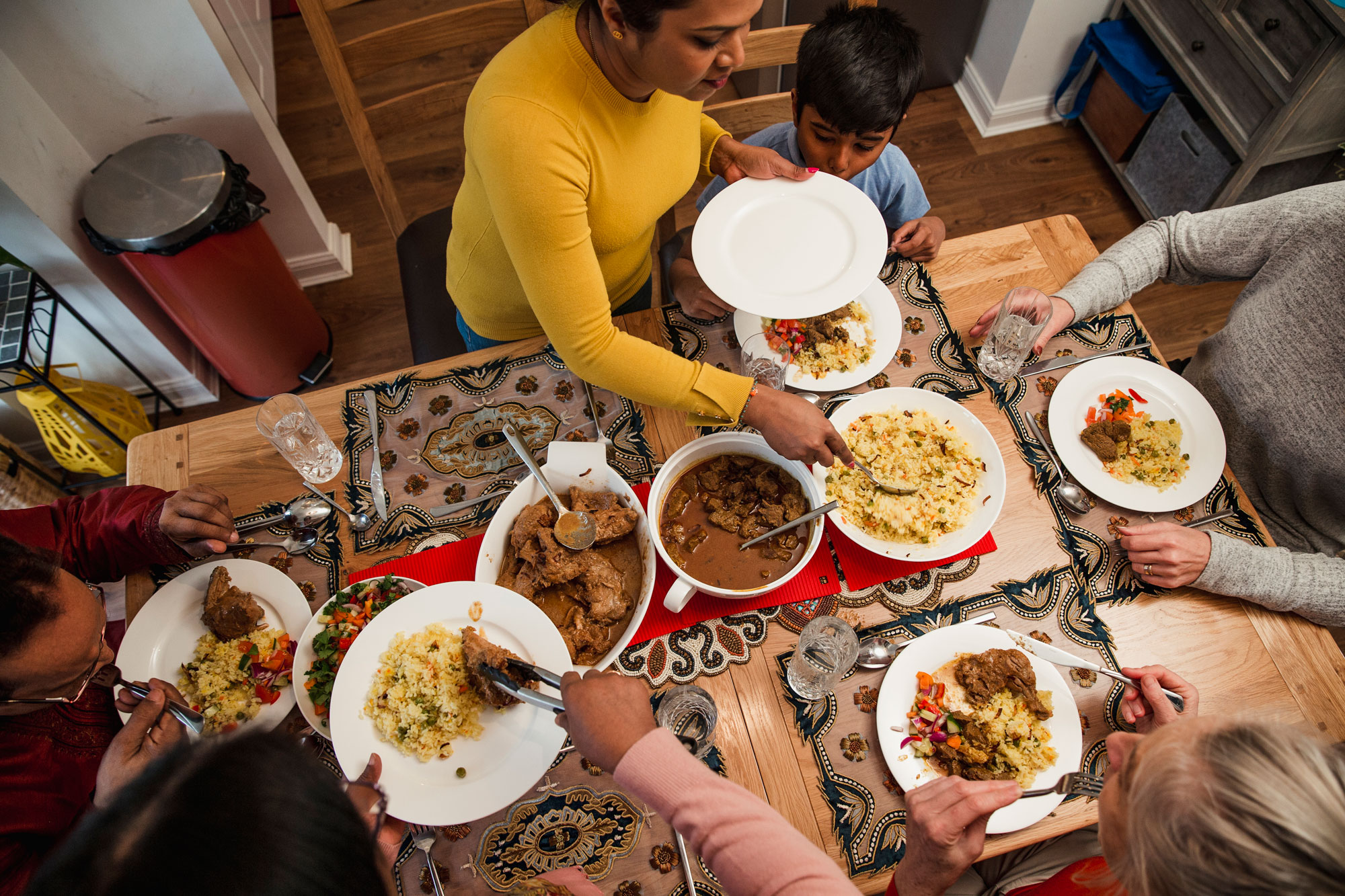 A family observing Ramadan at the table with a meal