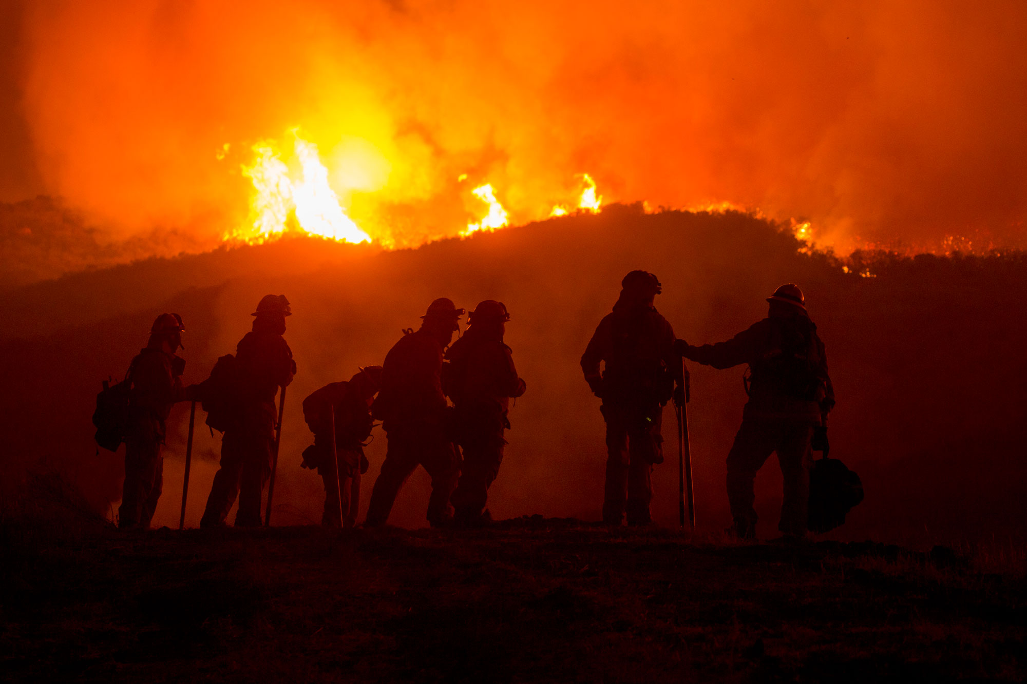 Firefighters serve long hours in arduous conditions as illustrated in this picture from the Thomas Fire in Ventura, California on the Los Padres National Forest in 2017 (Forest Service photo by Kari Greer)