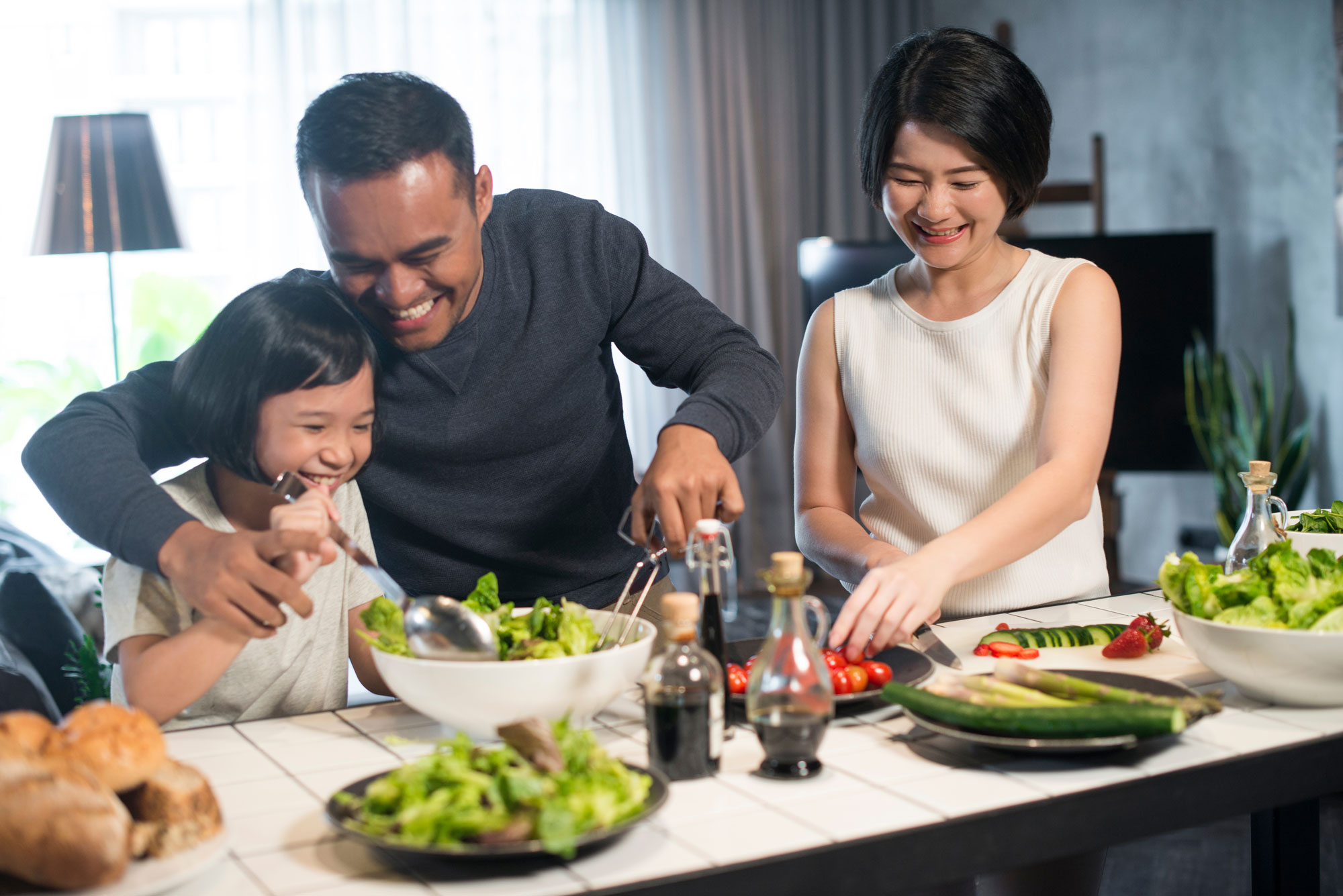 Family eating food at a dinner table