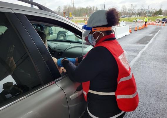 A member of the USDA Response Team administers a COVID-19 vaccine in Waldorf, MD