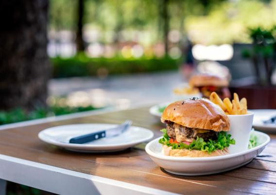 A burger with fries on a table