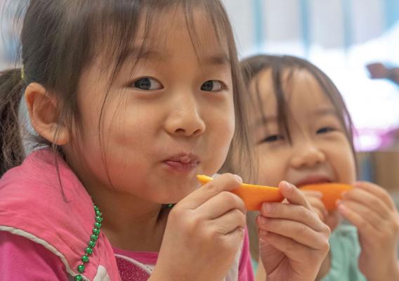 Two girls eating