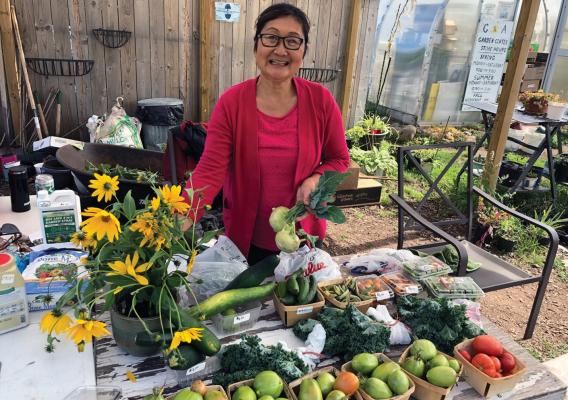 A woman at a farmers market in Houghton, Michigan