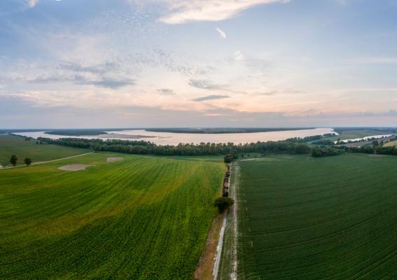 A landscape showing fields and water