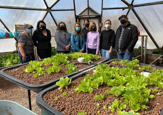 USDA officials touring the greenhouse at Red Cloud Indian School in Pine Ridge