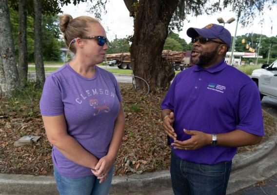 A USDA Rural Development employee talks with a woman