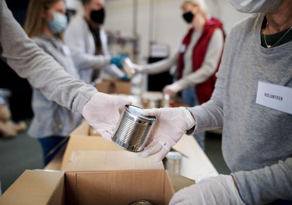 A volunteer at a food pantry