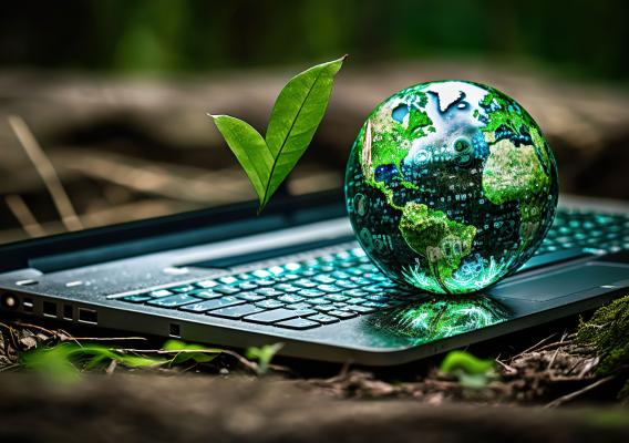 A globe on top of a laptop