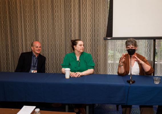 Three people seated at the National Association of Workforce Boards